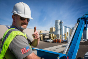 Travis Tatum, American Ag Systems Co-founder giving a thumbs up